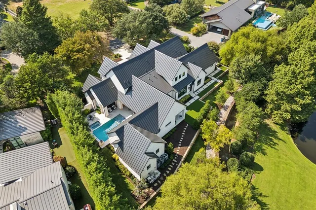 a small garden with trees in the background