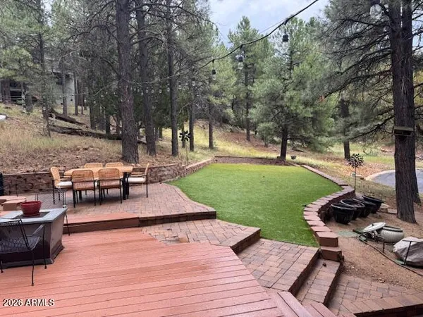 a view of a backyard with sitting area