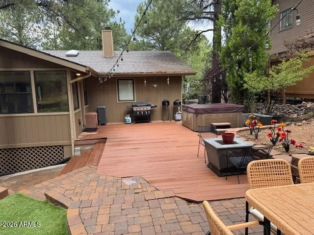 a view of a patio with table and chairs and potted plants