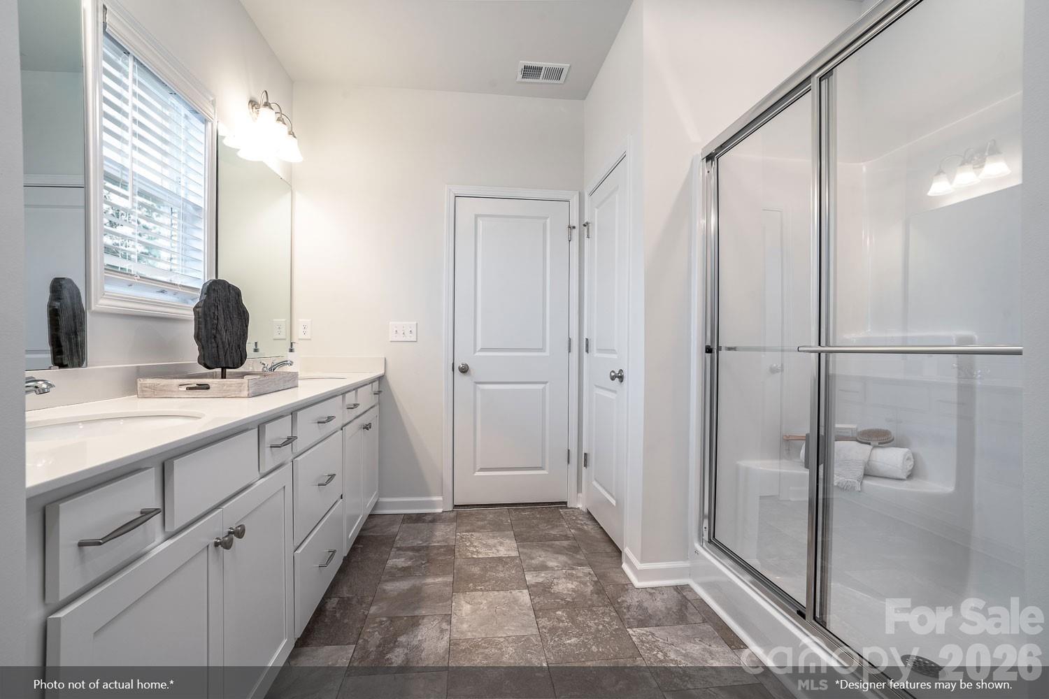 204 Rodeo Drive, Unit 26 Shelby, NC 28150 - Photo 15 of 19 a bathroom with a double vanity sink and mirror