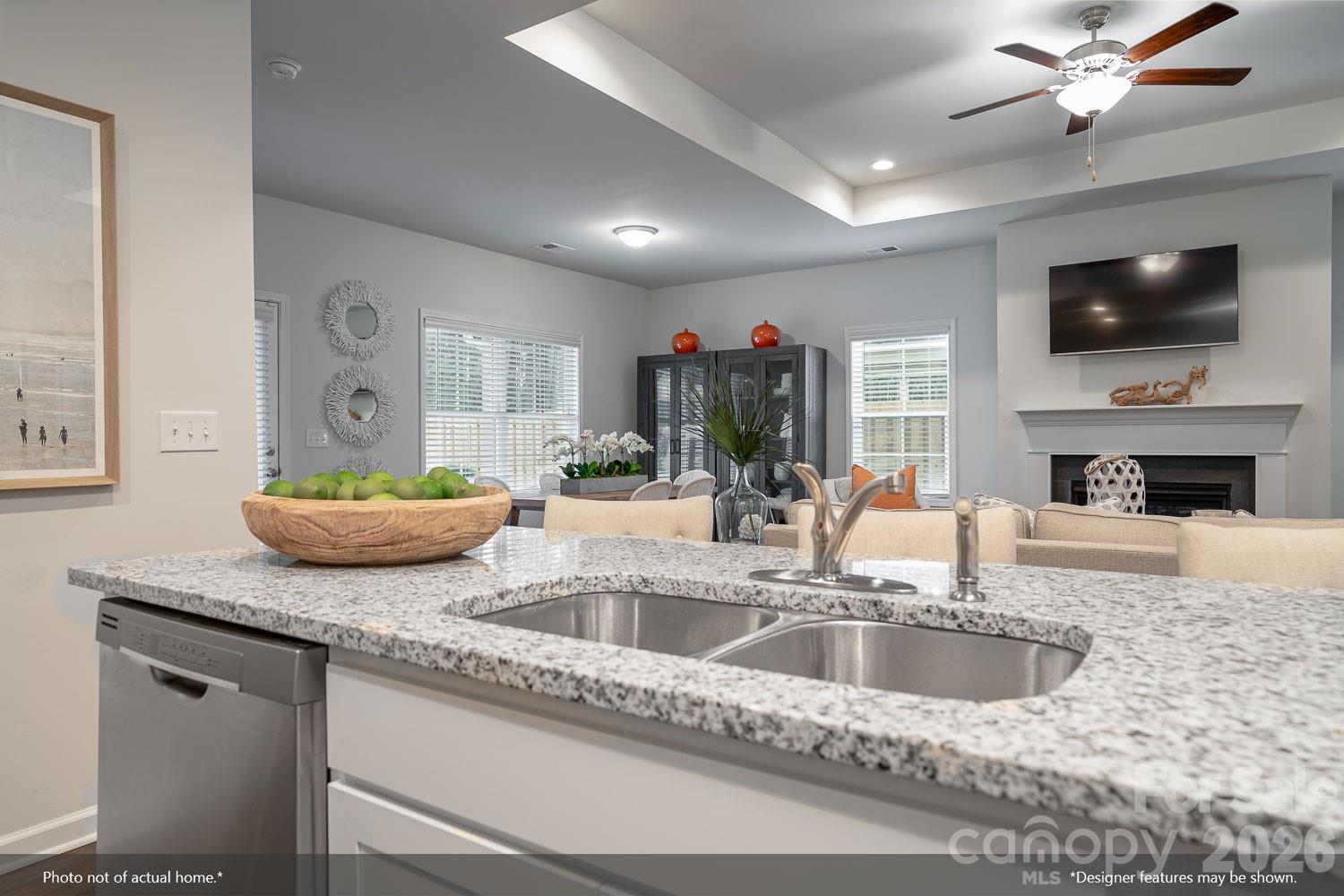 204 Rodeo Drive, Unit 26 Shelby, NC 28150 - Photo 6 of 19 a kitchen with a sink a microwave a dining table and chairs