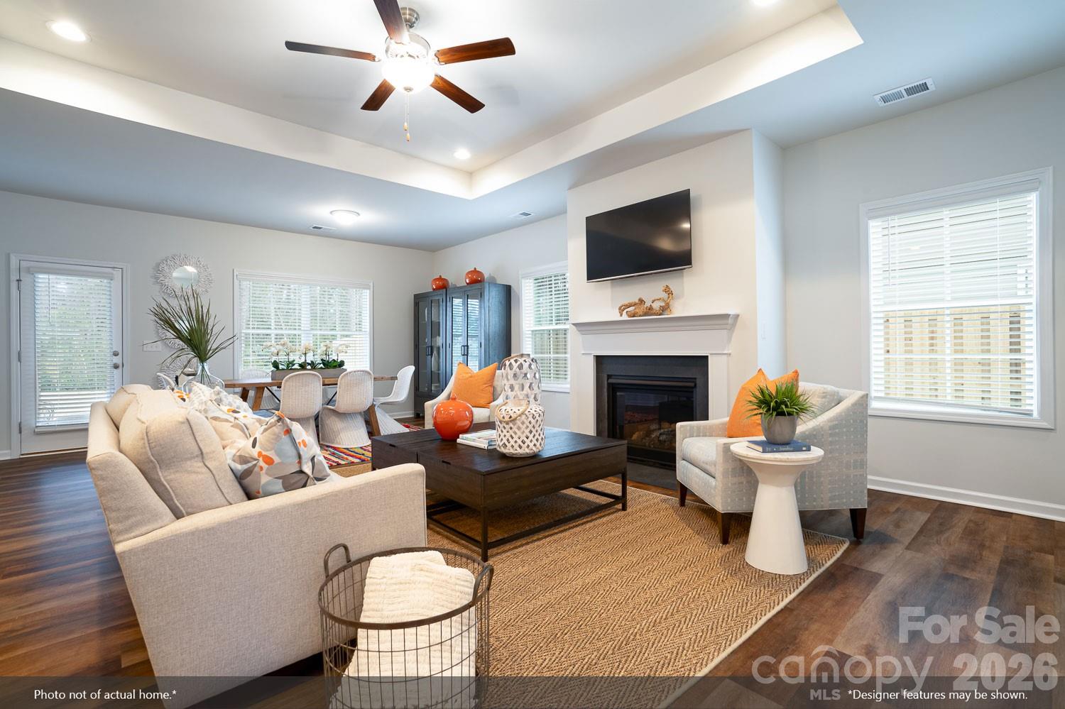 204 Rodeo Drive, Unit 26 Shelby, NC 28150 - Photo 9 of 19 a living room with furniture a flat screen tv and a fireplace
