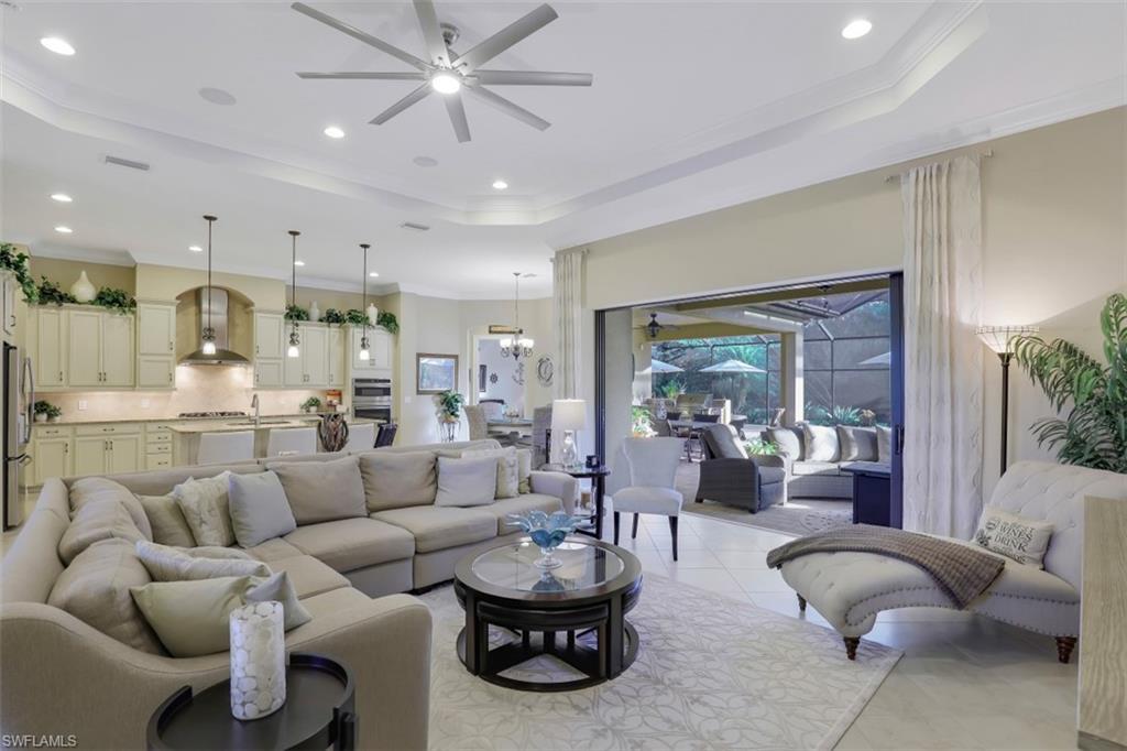 Undisclosed Address Naples, FL 34120 - Photo 11 of 33 a living room with furniture and a large window