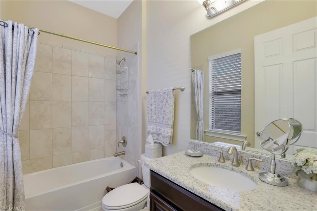 Undisclosed Address Naples, FL 34120 - Photo 15 of 33 a bathroom with a granite countertop sink toilet and shower