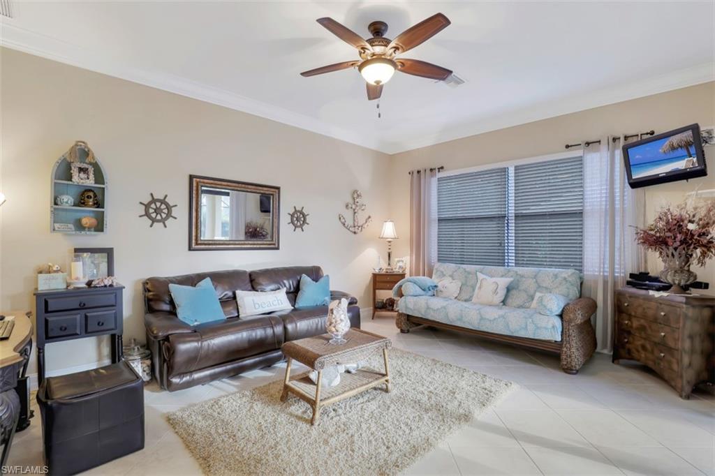 Undisclosed Address Naples, FL 34120 - Photo 16 of 33 a living room with furniture and a large window