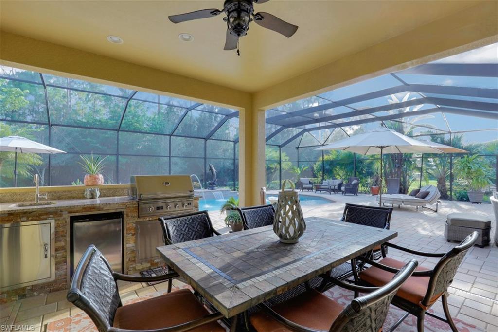 Undisclosed Address Naples, FL 34120 - Photo 21 of 33 a view of a tables and chairs in patio