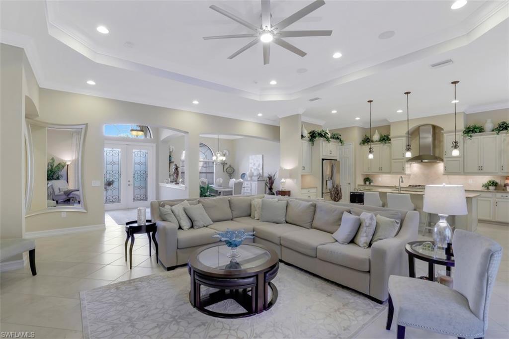 Undisclosed Address Naples, FL 34120 - Photo 23 of 33 a living room with furniture and a large window