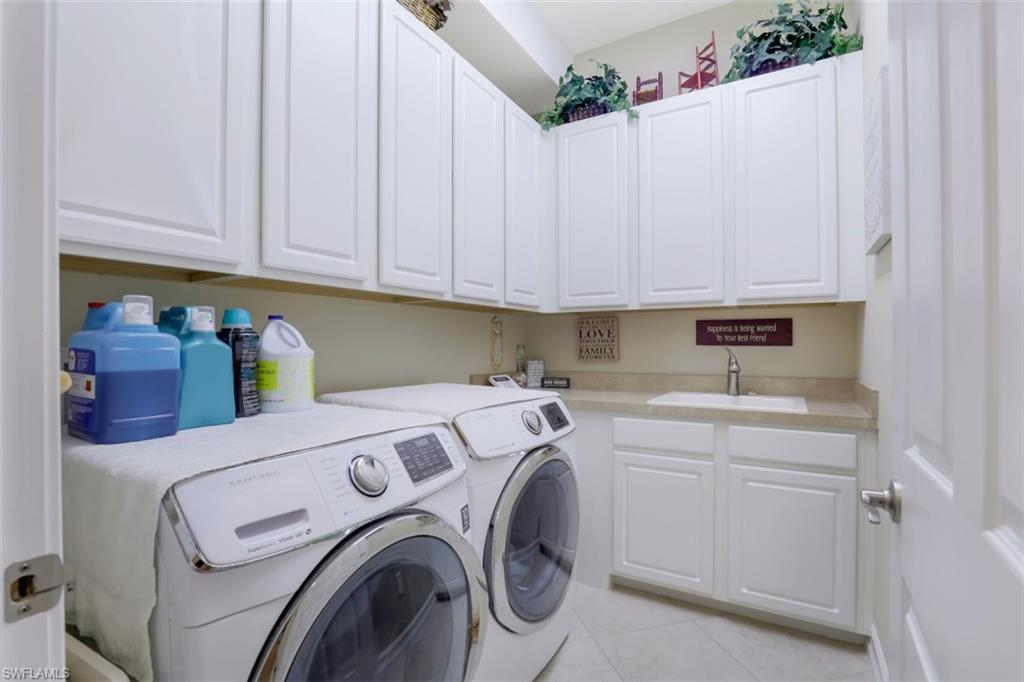 Undisclosed Address Naples, FL 34120 - Photo 24 of 33 a utility room with dryer and washer