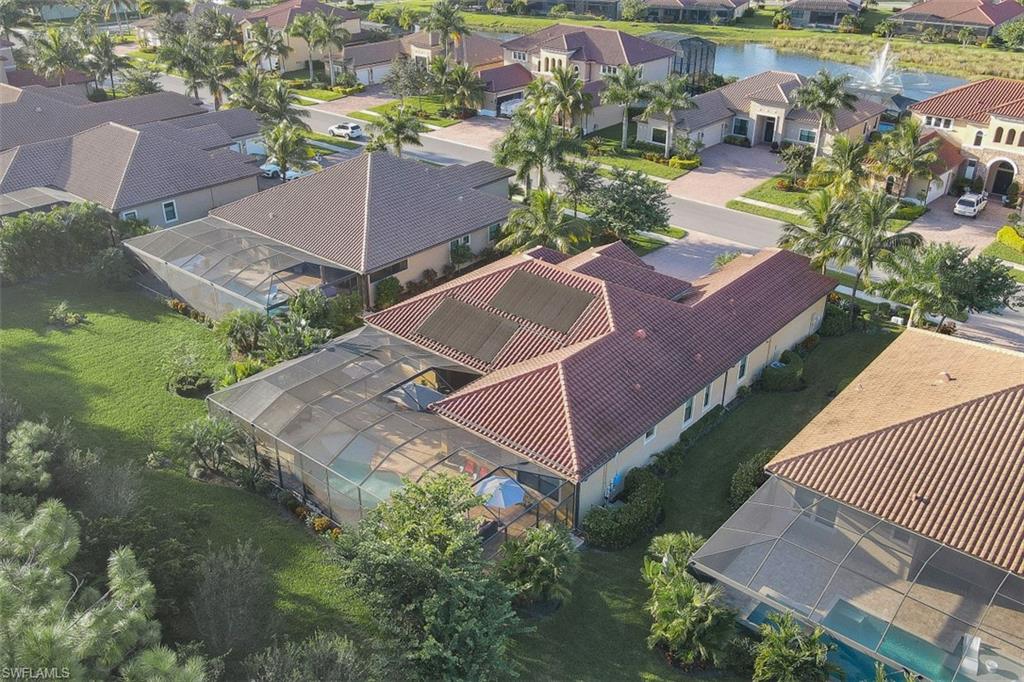 Undisclosed Address Naples, FL 34120 - Photo 31 of 33 an aerial view of a house with a garden