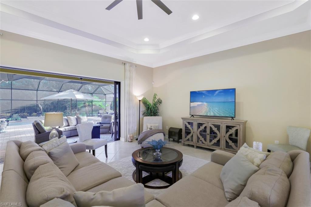 Undisclosed Address Naples, FL 34120 - Photo 4 of 33 a living room with furniture and a large window