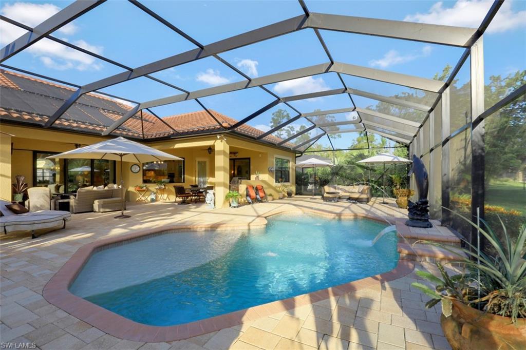 Undisclosed Address Naples, FL 34120 - Photo 8 of 33 a view of a swimming pool with a patio