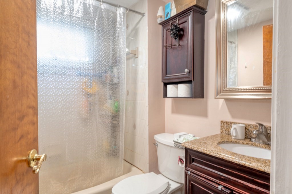 19 Crescent Road Weymouth, MA 02191 - Photo 12 of 24 a bathroom with a granite countertop sink toilet and shower
