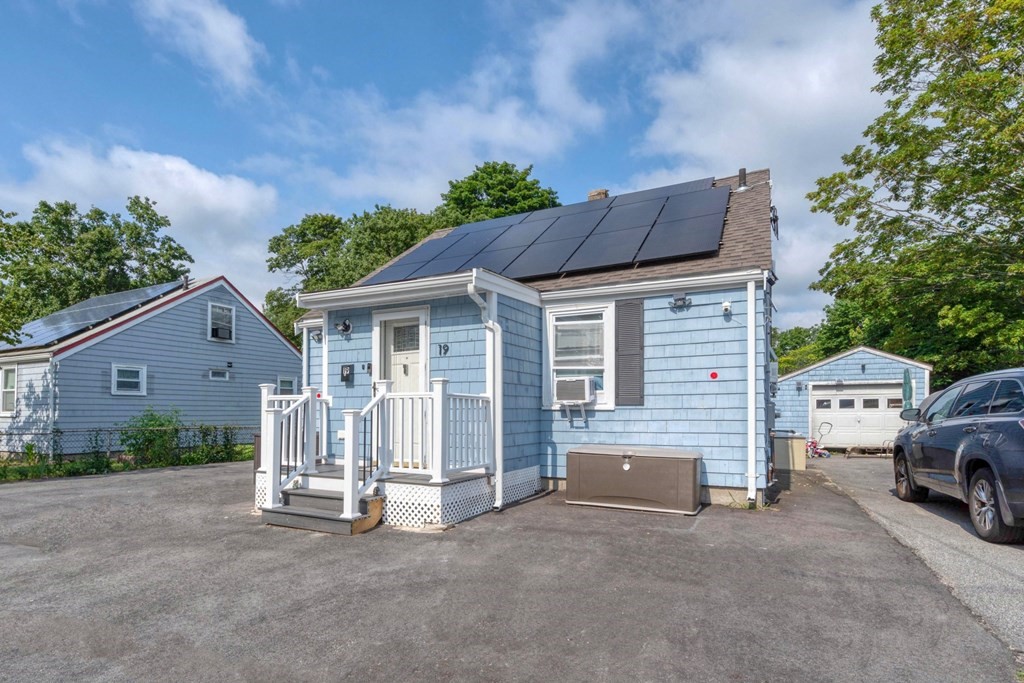 19 Crescent Road Weymouth, MA 02191 - Photo 3 of 24 a view of a house with a patio and a yard