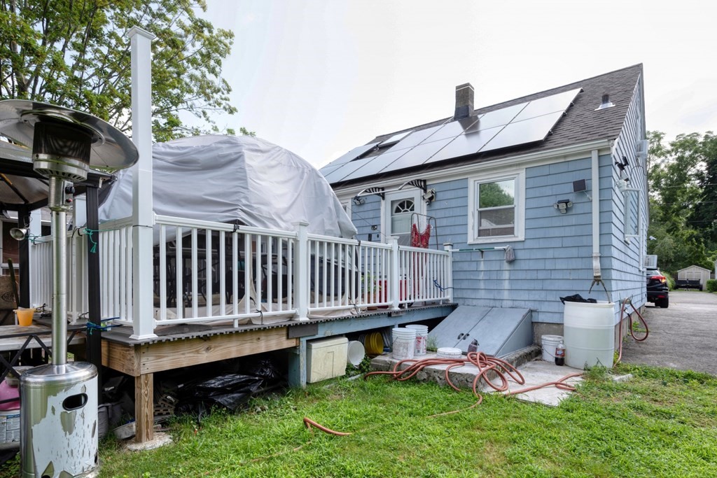 19 Crescent Road Weymouth, MA 02191 - Photo 4 of 24 a backyard of a house with table and chairs