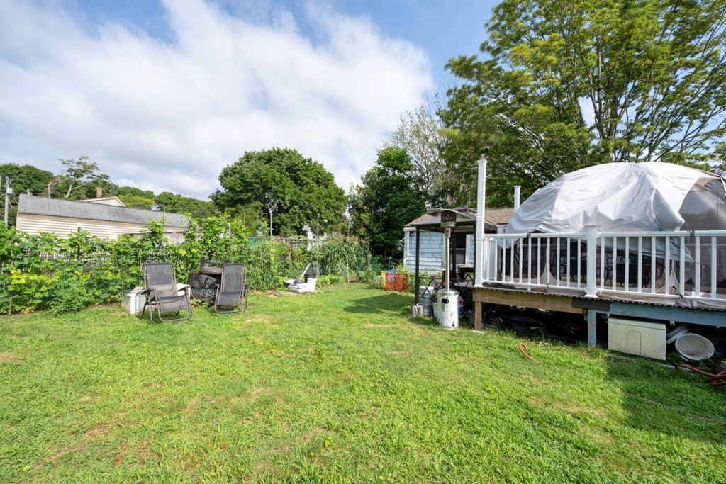 19 Crescent Road Weymouth, MA 02191 - Photo 5 of 24 a view of a house with backyard and a hammock