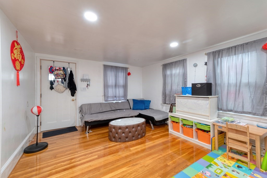 19 Crescent Road Weymouth, MA 02191 - Photo 6 of 24 a living room with furniture and a flat screen tv