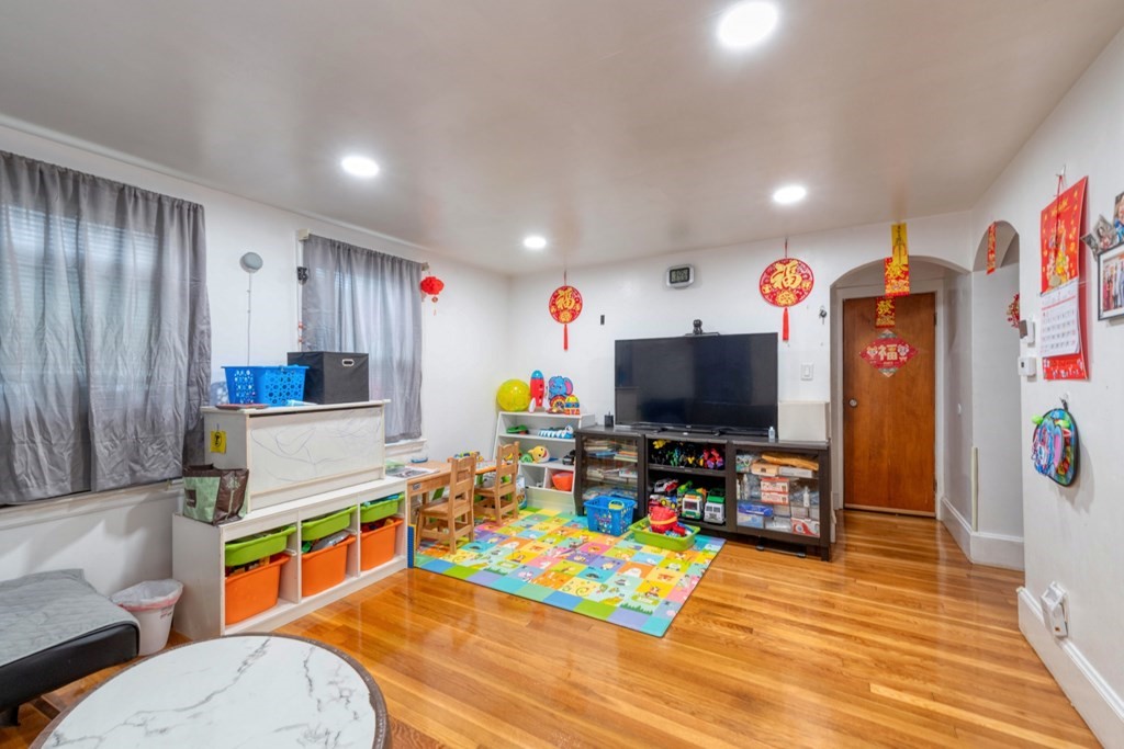 19 Crescent Road Weymouth, MA 02191 - Photo 7 of 24 a living room with furniture and a flat screen tv