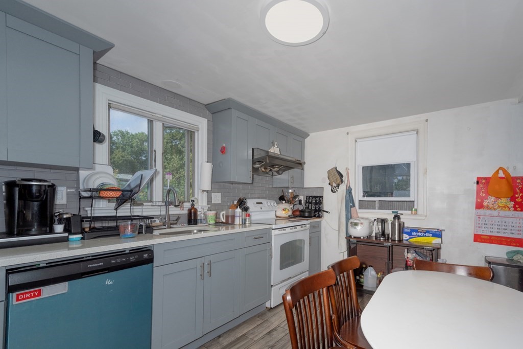 19 Crescent Road Weymouth, MA 02191 - Photo 9 of 24 a kitchen that has a sink and a stove in it
