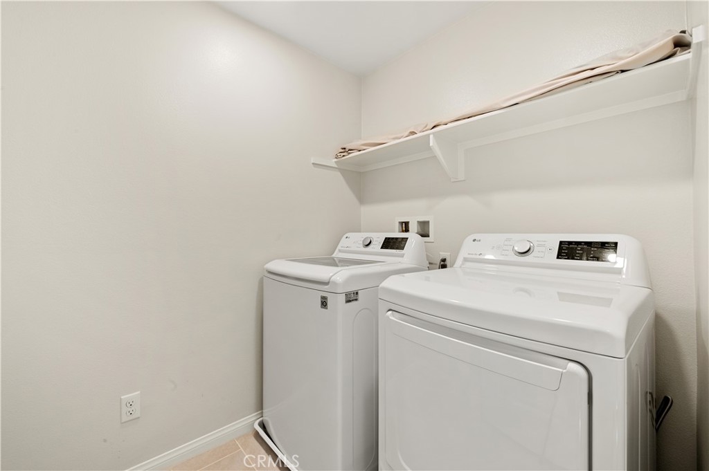 128 Spectacle Irvine, CA 92618 - Photo 11 of 31 a utility room with dryer and washer