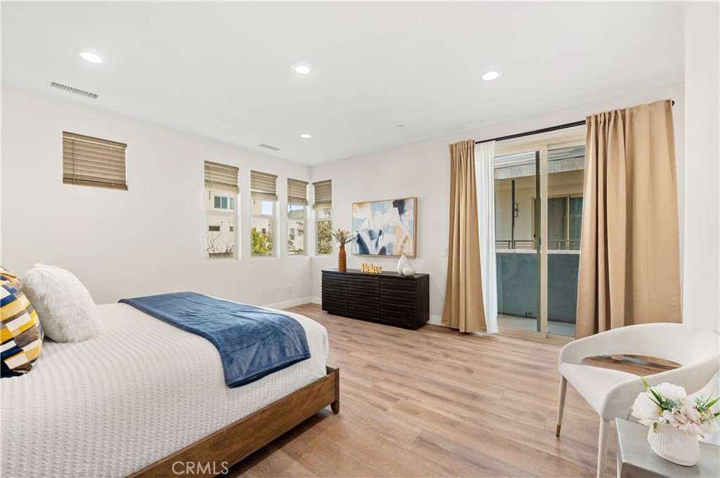 128 Spectacle Irvine, CA 92618 - Photo 15 of 31 a bedroom with a large bed and a window