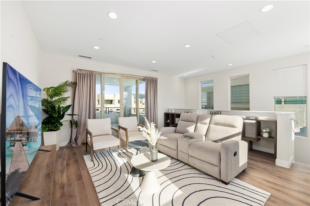 128 Spectacle Irvine, CA 92618 - Photo 16 of 31 a living room with furniture and a large window