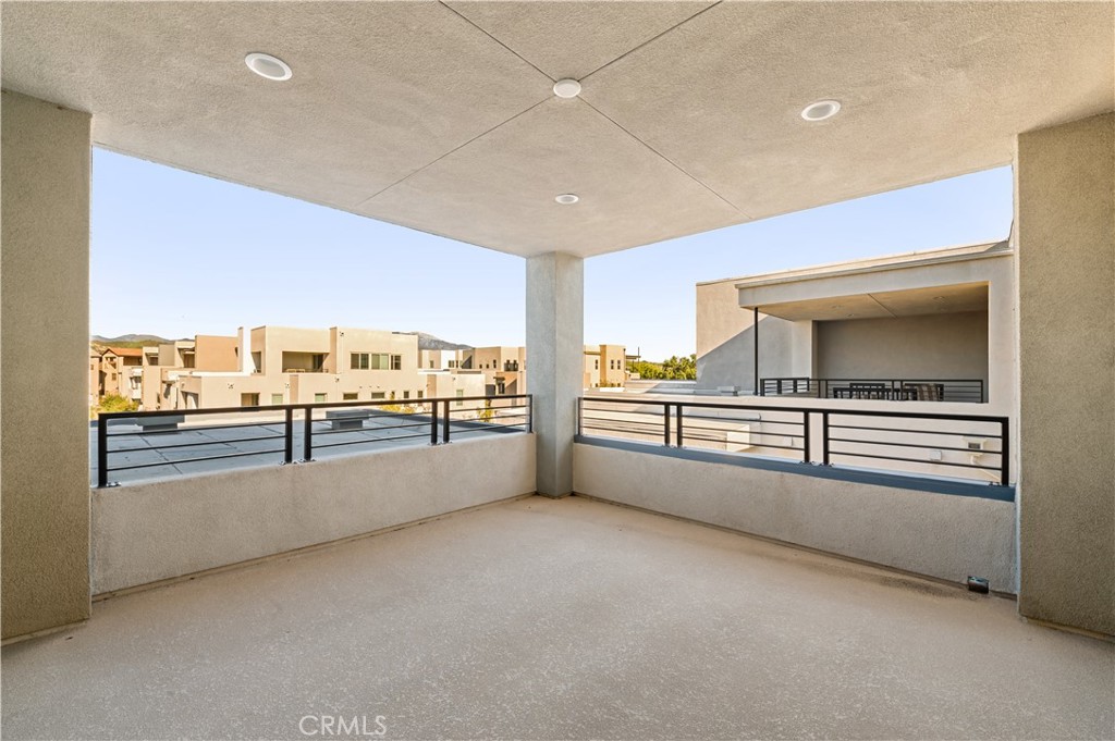 128 Spectacle Irvine, CA 92618 - Photo 18 of 31 a view of a living room with kitchen view and an empty room