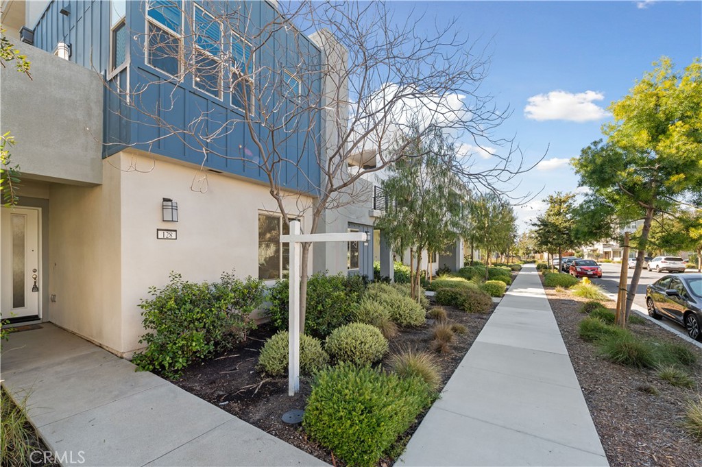 128 Spectacle Irvine, CA 92618 - Photo 20 of 31 a front view of a house with garden