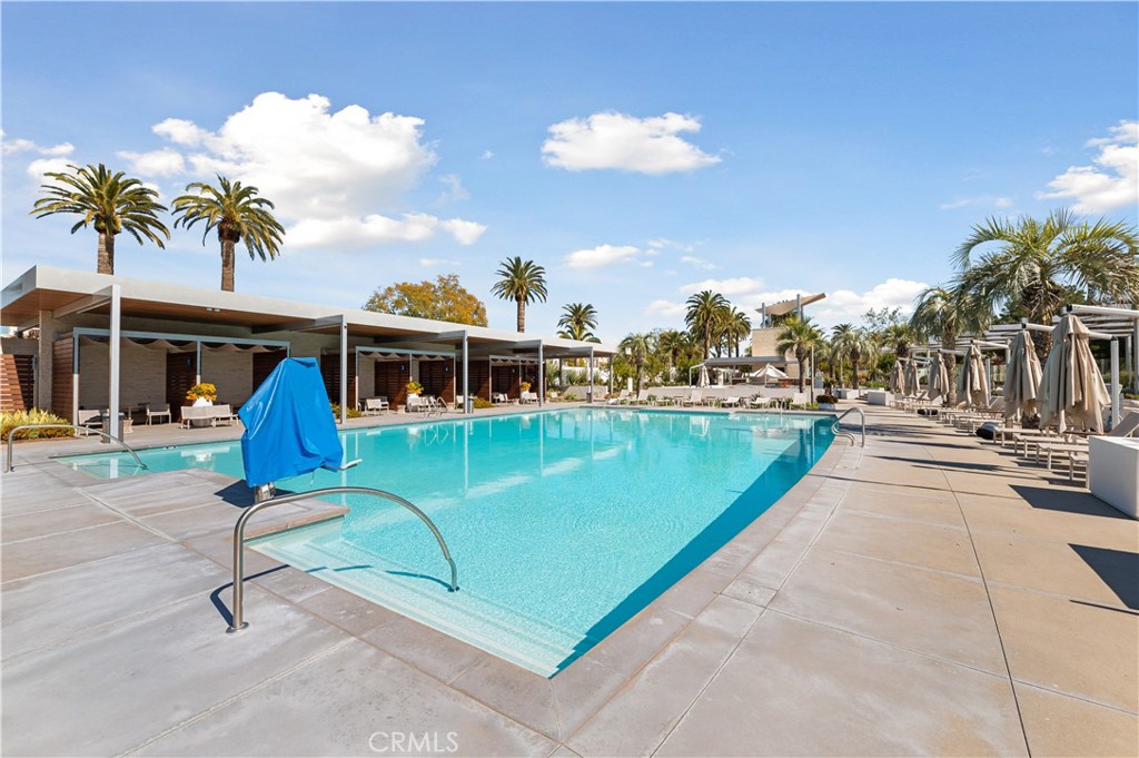 128 Spectacle Irvine, CA 92618 - Photo 26 of 31 a view of a swimming pool with a lounge chairs