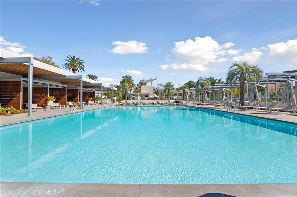 128 Spectacle Irvine, CA 92618 - Photo 30 of 31 a view of a swimming pool with a lawn chairs