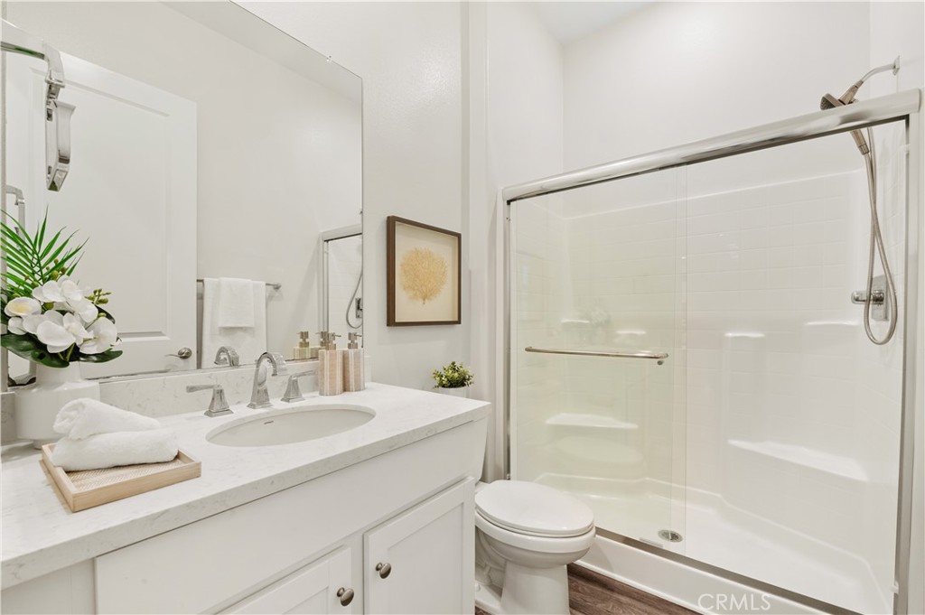 128 Spectacle Irvine, CA 92618 - Photo 6 of 31 a bathroom with a sink toilet and shower