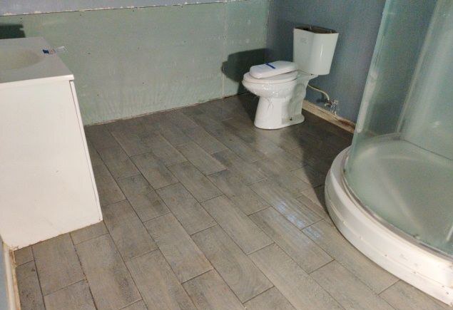 9606 South Morgan Street Chicago, IL 60643 - Photo 9 of 16 a white toilet sitting next to a white sink