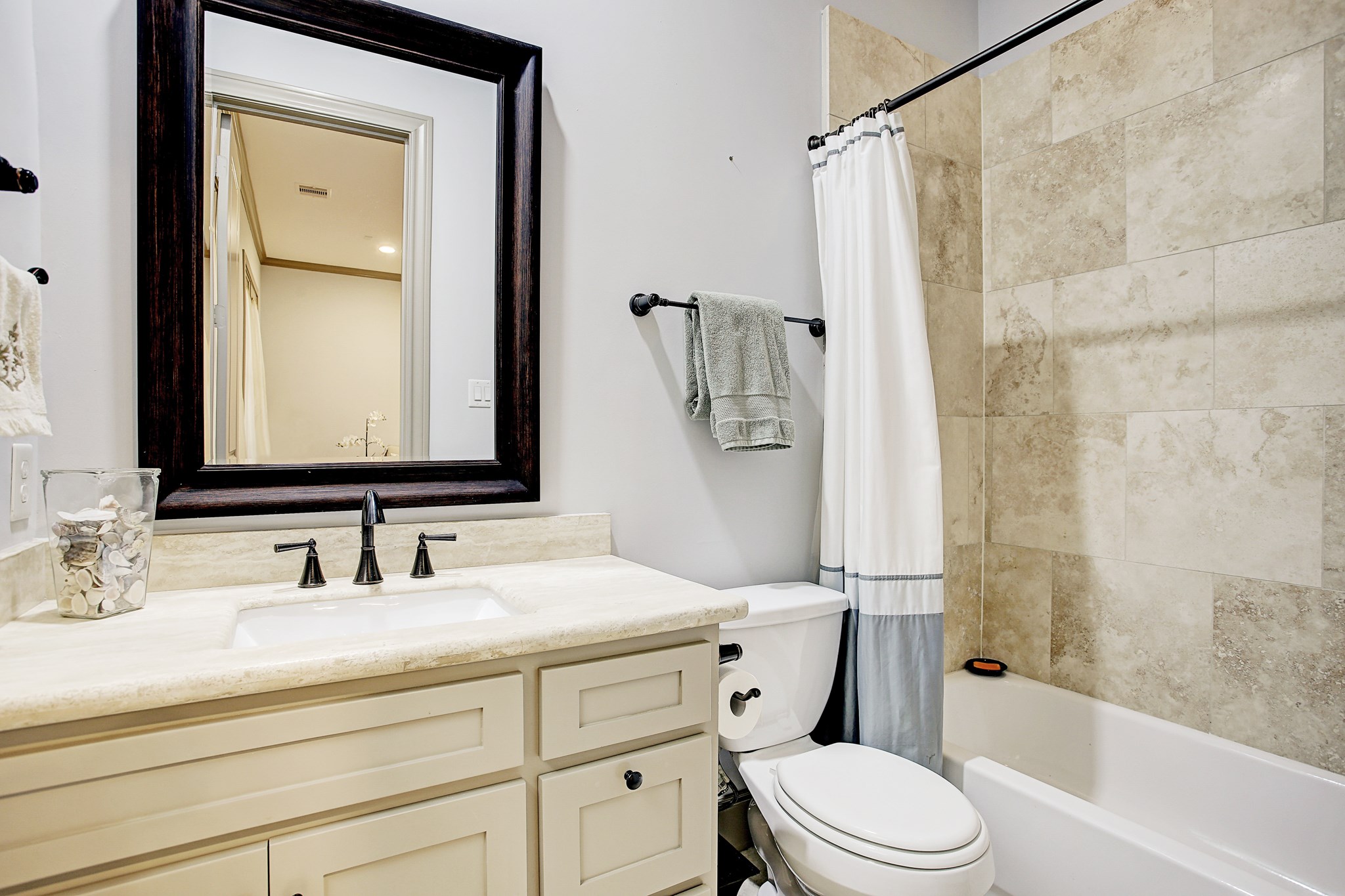 1307 Rosedale Street Houston, TX 77004 - Photo 10 of 32 a bathroom with a sink a toilet and shower