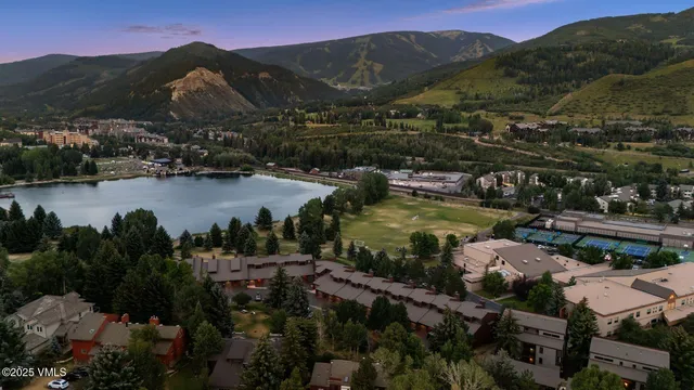 a view of a town with mountains in the background