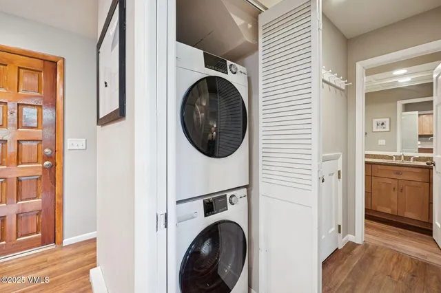 a view of a hallway with washer and dryer