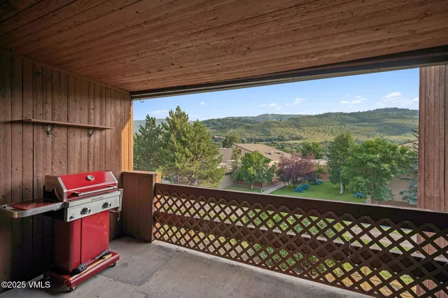 a view of a two chairs in the balcony