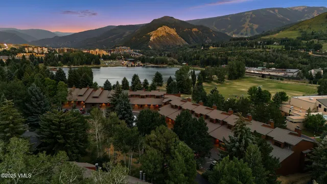 a bedroom with furniture and a large window