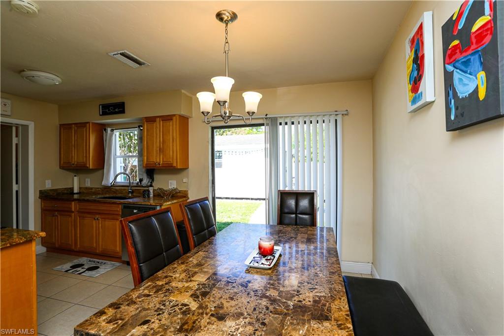 5140 20th Court Southwest Naples, FL 34116 - Photo 12 of 33 a view of a living room and dining room