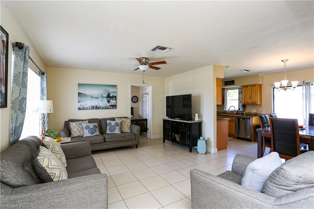 5140 20th Court Southwest Naples, FL 34116 - Photo 14 of 33 a living room with furniture and a flat screen tv