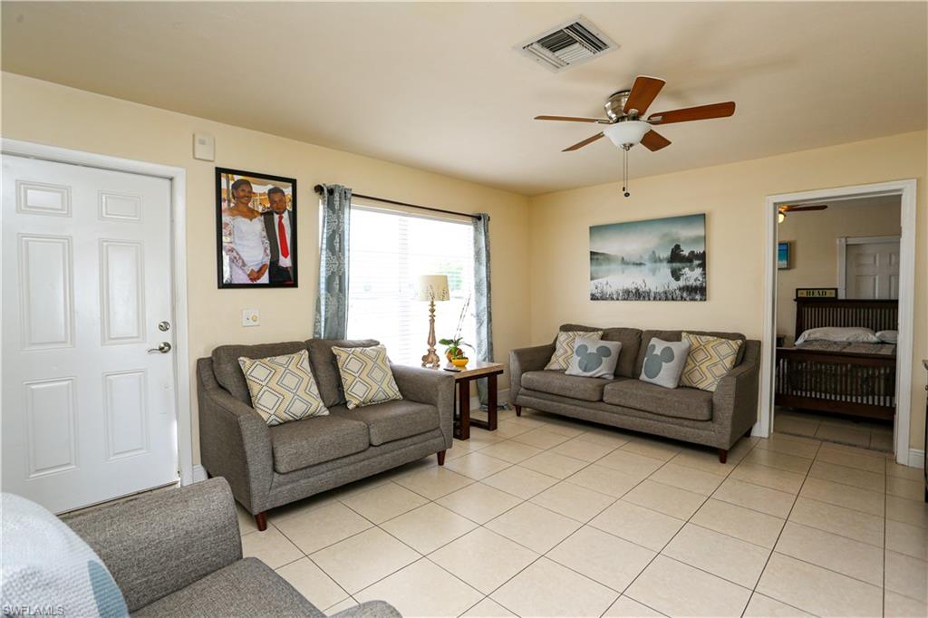 5140 20th Court Southwest Naples, FL 34116 - Photo 15 of 33 a living room with furniture and a ceiling fan