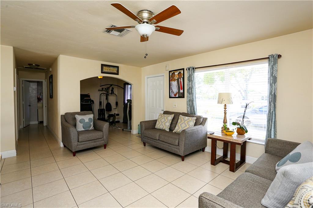 5140 20th Court Southwest Naples, FL 34116 - Photo 17 of 33 a living room with furniture and a large window