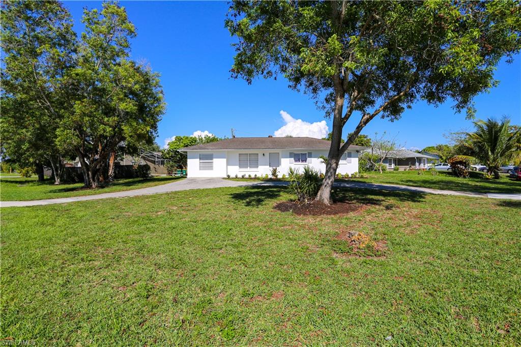 5140 20th Court Southwest Naples, FL 34116 - Photo 3 of 33 a view of a house with a yard
