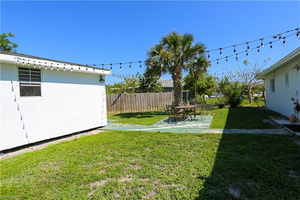 5140 20th Court Southwest Naples, FL 34116 - Photo 32 of 33 a view of a house with backyard and sitting area