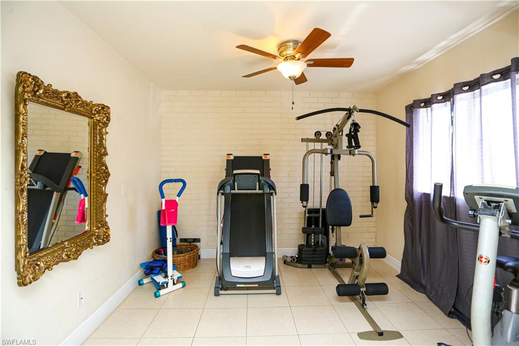 5140 20th Court Southwest Naples, FL 34116 - Photo 7 of 33 a view of a room with gym equipment