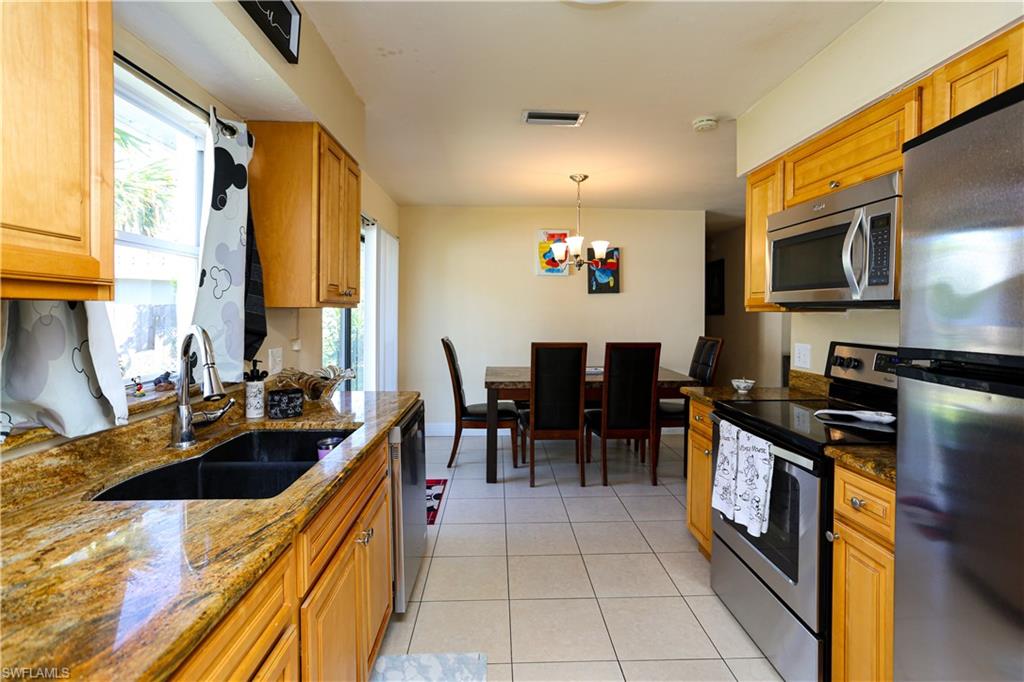 5140 20th Court Southwest Naples, FL 34116 - Photo 9 of 33 a kitchen with lots of counter top space