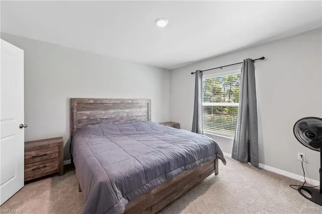 a bedroom with a bed and a cabinets