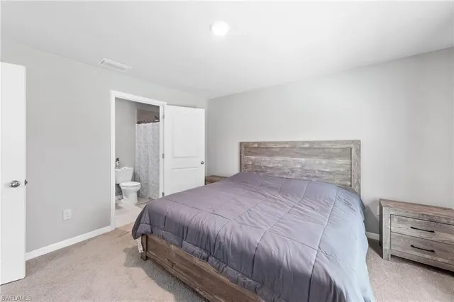 a bedroom with a bed and a cabinets