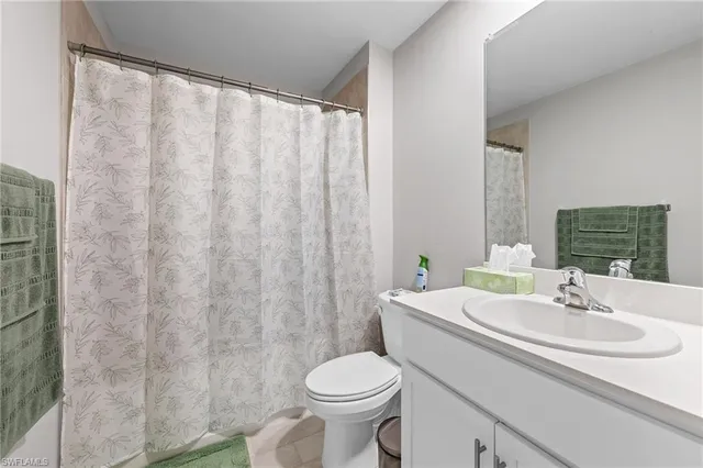a bathroom with a sink and toilet