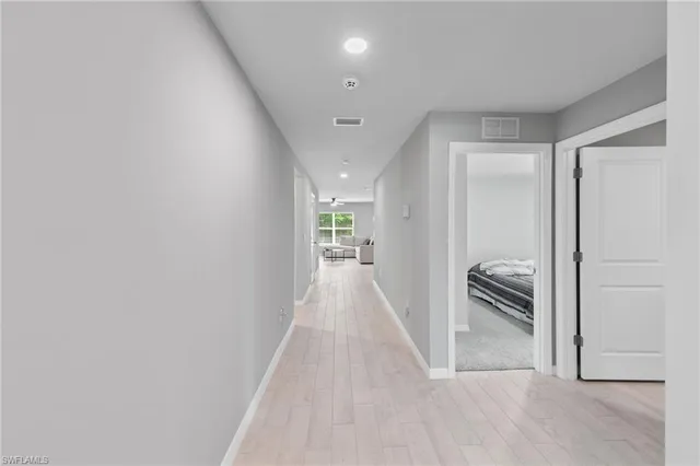 wooden floor in a hall with an entryway