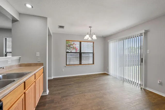 a view of a kitchen from the hallway