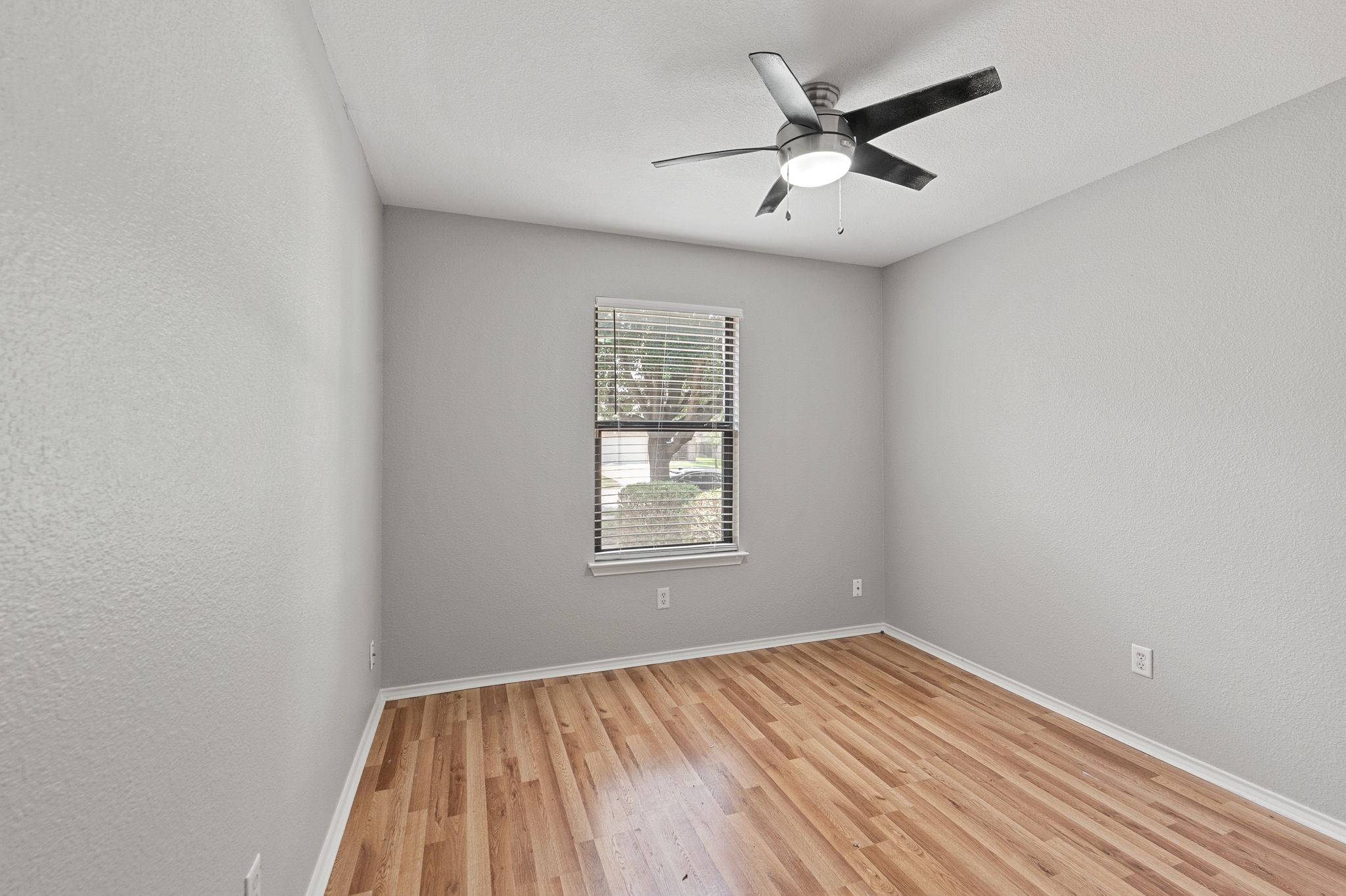 4209 Glacier Point Cove Taylor, TX 76574 - Photo 17 of 36 wooden floor in an empty room with a window